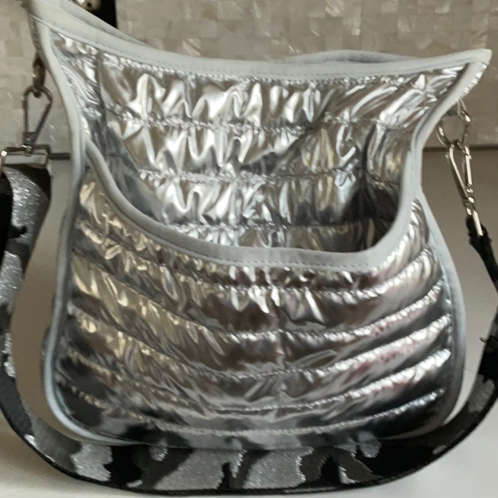 ah dorned silver matalic crossbody bag.